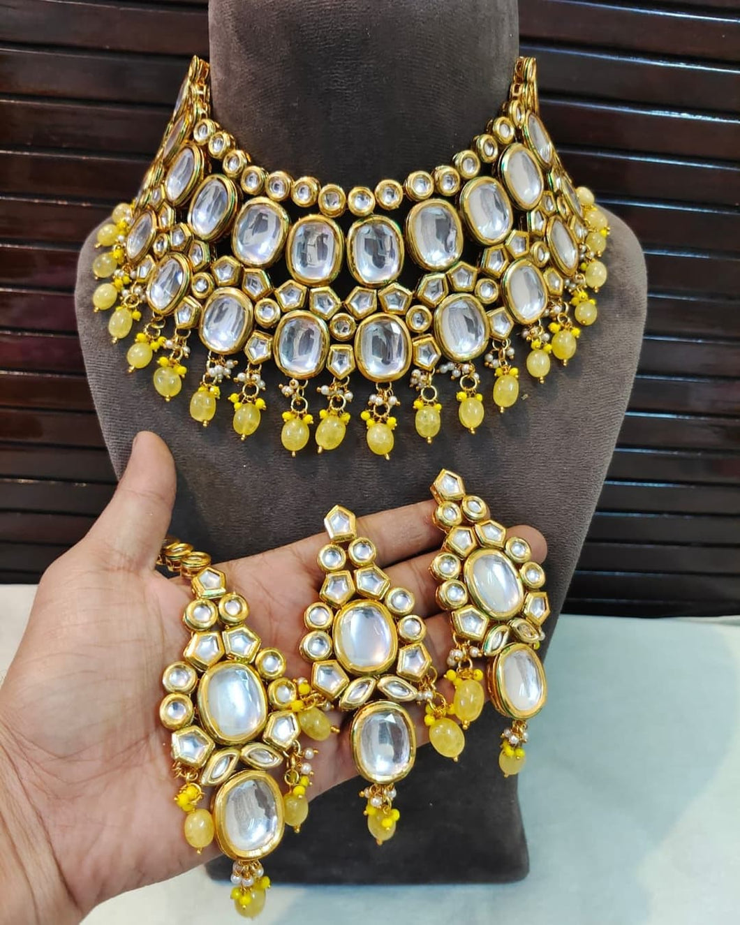Yellow kundan set with earrings and maangtika